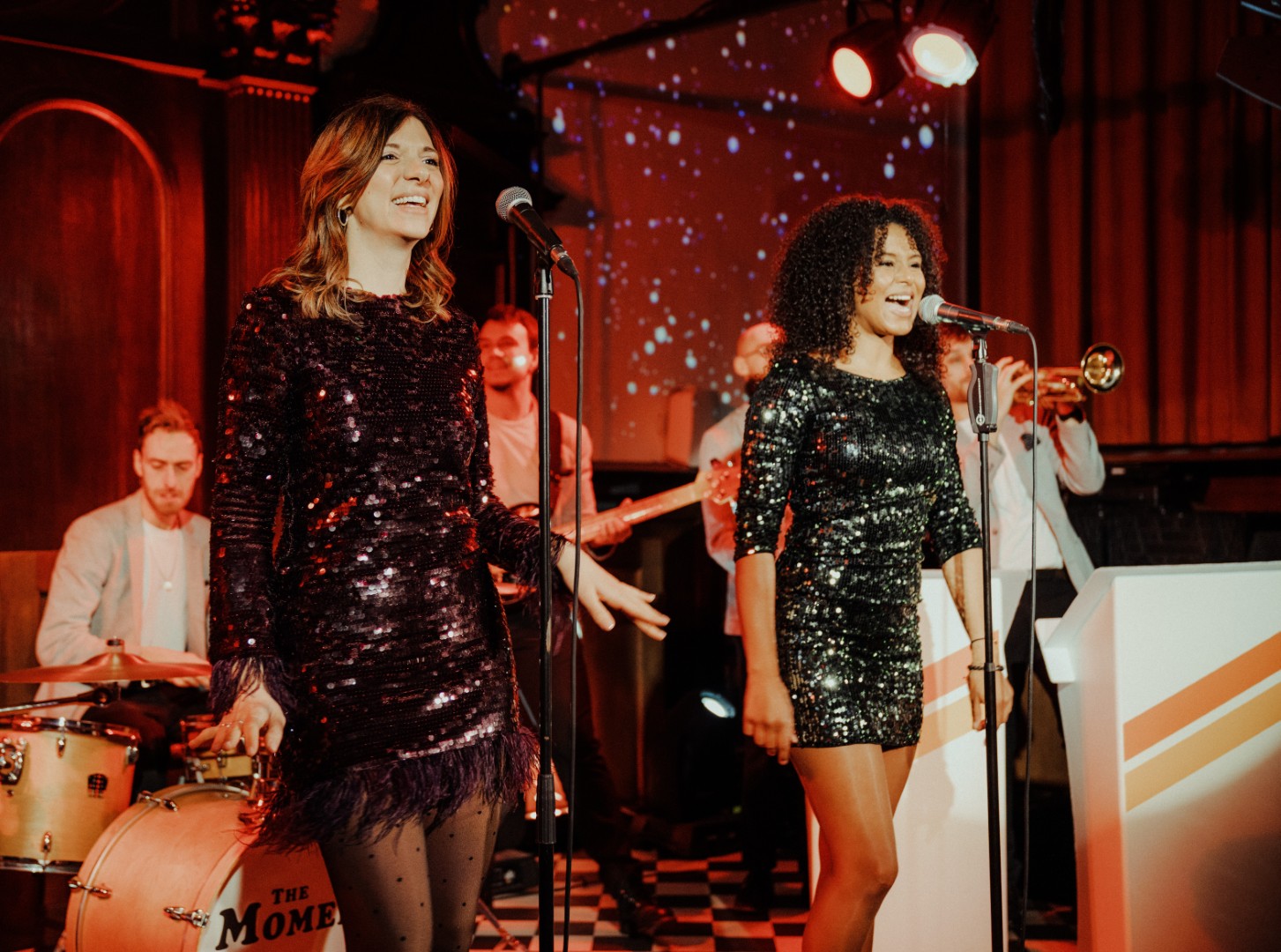 The Moments performing live